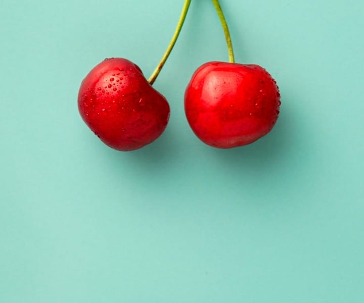 two cherries side by side without leaf